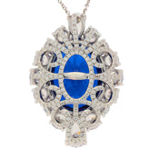 Elegant oval blue sapphire sterling silver pendant with sparkling accents, perfect for sophisticated style.